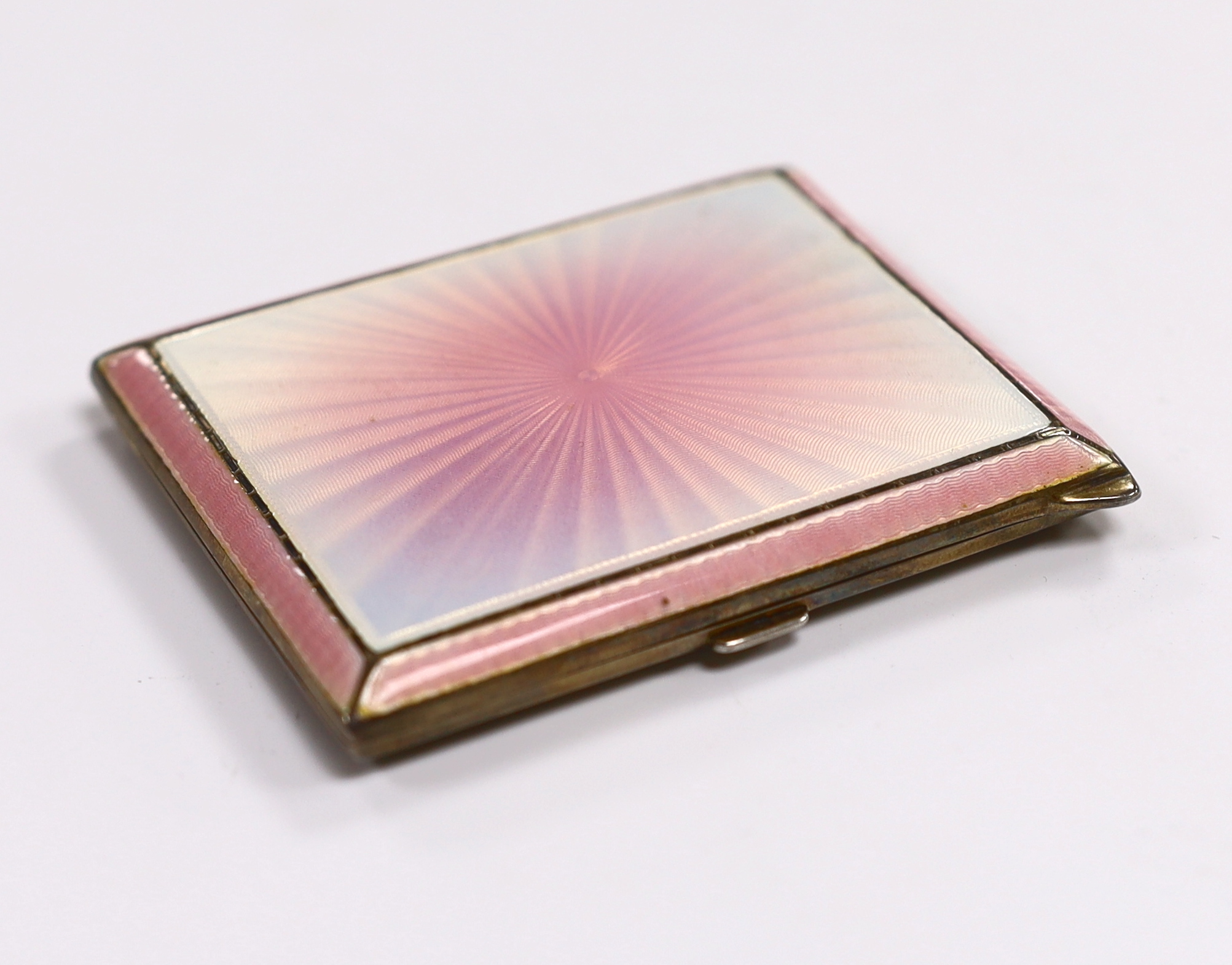 A George VI silver pink guilloche enamel cigarette case, by Albert Carter, Birmingham, 1938, 81mm.